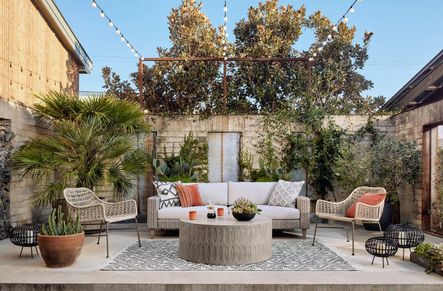 SHOP THE LOOK: Bandera Outdoor Woven Club Chair, Colorado Drum Coffee Table, Remi Outdoor Sofa, Black &amp; Cream Diamond Pillow Set, Burbank Aragon Pillow