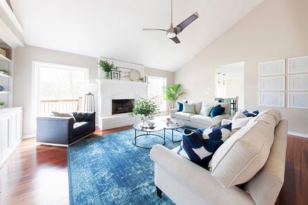 SHOP THE LOOK Catalina Nesting Coffee Table (Discontinued), Maxx Swivel Chair, Safflower Blue Velvet Pillow, Uttermost Adrian Modern Floor Lamp