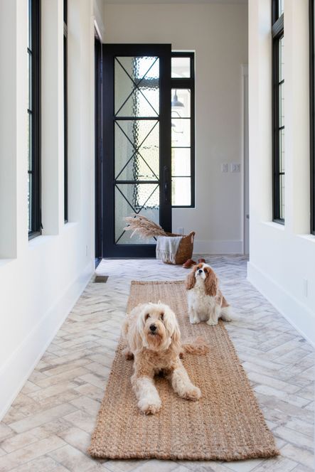 Agnus &amp; Frannie are particularly fond of the herringbone tile in this hallway.