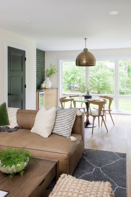 SHOP THE LOOK | Earthshine Brass Large Pendant, Valeria Coffee Table, Oak Cove Pouf, Safflower Green Velvet Pillow, Catalina Ivory Pillow, Ripley Dining Chair, Briella Pillow, Nolita Sectional, Satellite Rug