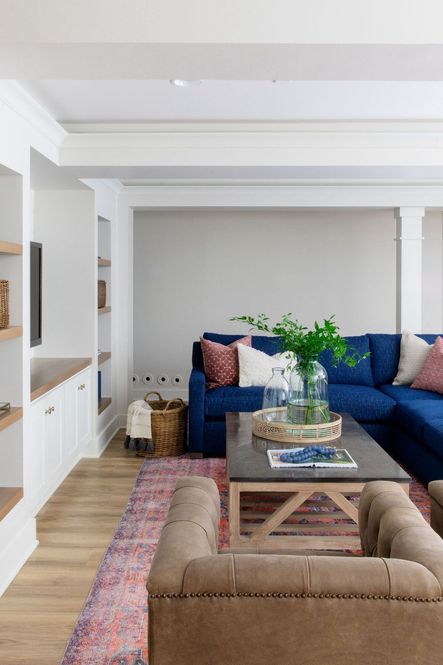 SHOP THE LOOK: Blue Stone Square Coffee Table, Menowin Medallion Blue &amp; Orange Area Rug, Maxx Swivel Chair