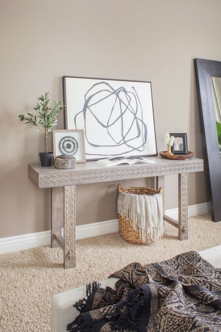 After: The Balboa Carved Console Table is the perfect stage for a gorgeous collection of art &amp; accessories.