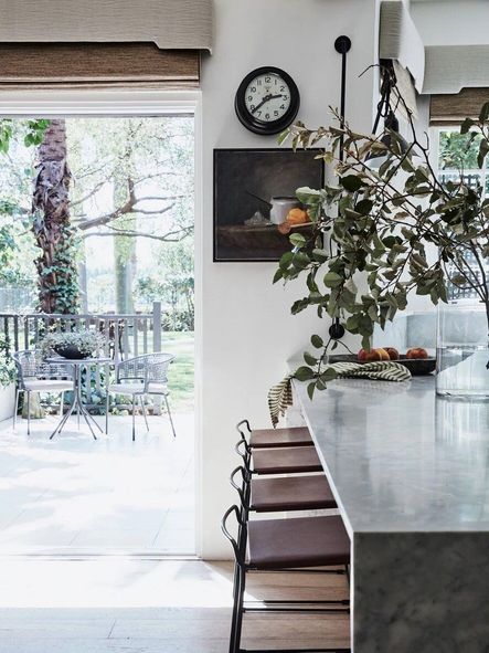 Directly open to the outdoor patio, one can enjoy serene views and fresh air while preparing meals.