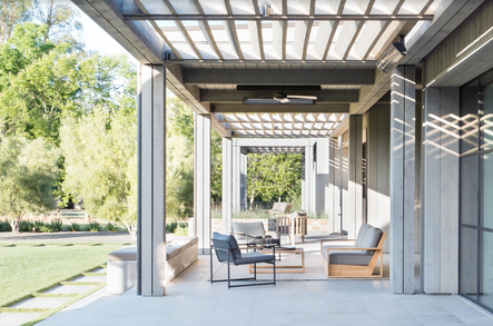 Simple and serene | A shaded patio provides a comfortable place to relax on even the sunniest days.