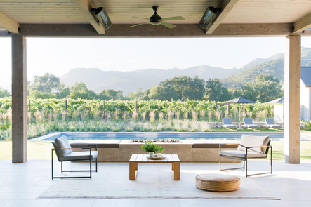Backyard Bliss | Yet another outdoor seating area over looks the pool and vineyard.