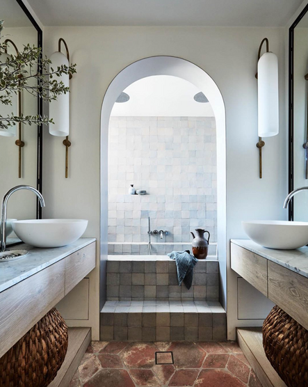 An arched entry to this show-stopping soaker tub is just one of the amazing details found in this bathroom.