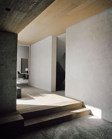 Vertical differences between spaces maintains visual continuity, but allows the rooms to remain separate from one another | photograph by François Halard
