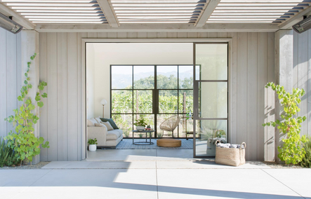 Open and Inviting | Large doors retract to reveal the pool house living area.