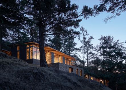 This home was built with the rugged, stony nature surrounding the property in mind. Inspired by an Appalachian Home lost to a fire, this house holds lots of charm and absolutely stunning views. Architecture by Hoedemaker Pfeiffer | Photo by Kevin Scott | Project Hillside Sanctuary