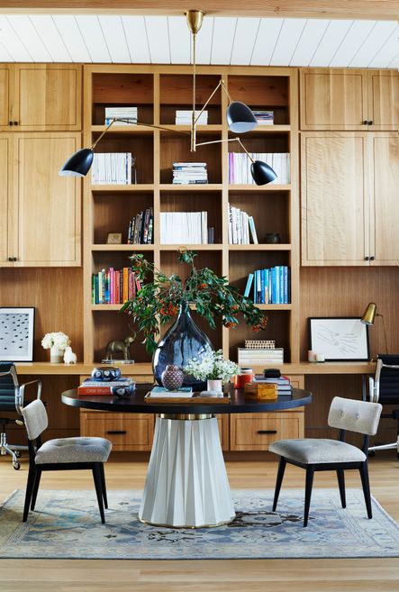 Built-in shelving is one of our favorite ways to incorporate storage into a space, and we’re loving it in this space. To maintain a clean and cohesive design, show off your beautiful book stacks in open shelves, while hiding your less organized things behind closed doors.