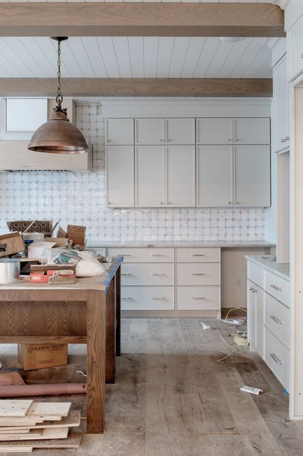 The Zellige tile in #SNStoneBluff has been installed! Shop the Admiral Pendant. The cabinets are Sea Salt by Benjamin Moore.